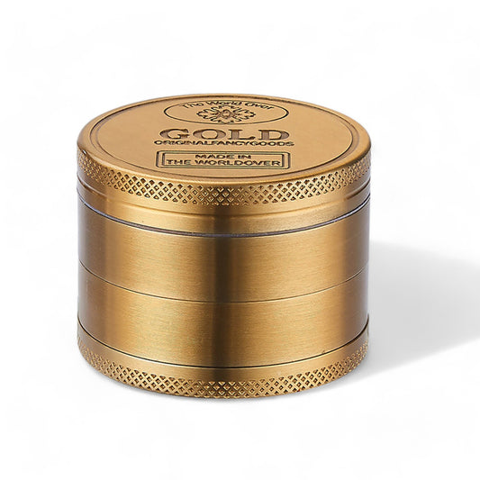 Luxuriöser 'Gold bar' Grinder mit 50 mm Durchmesser und vier Segmenten, ideal für die elegante Zerkleinerung von Kräutern und Gewürzen.